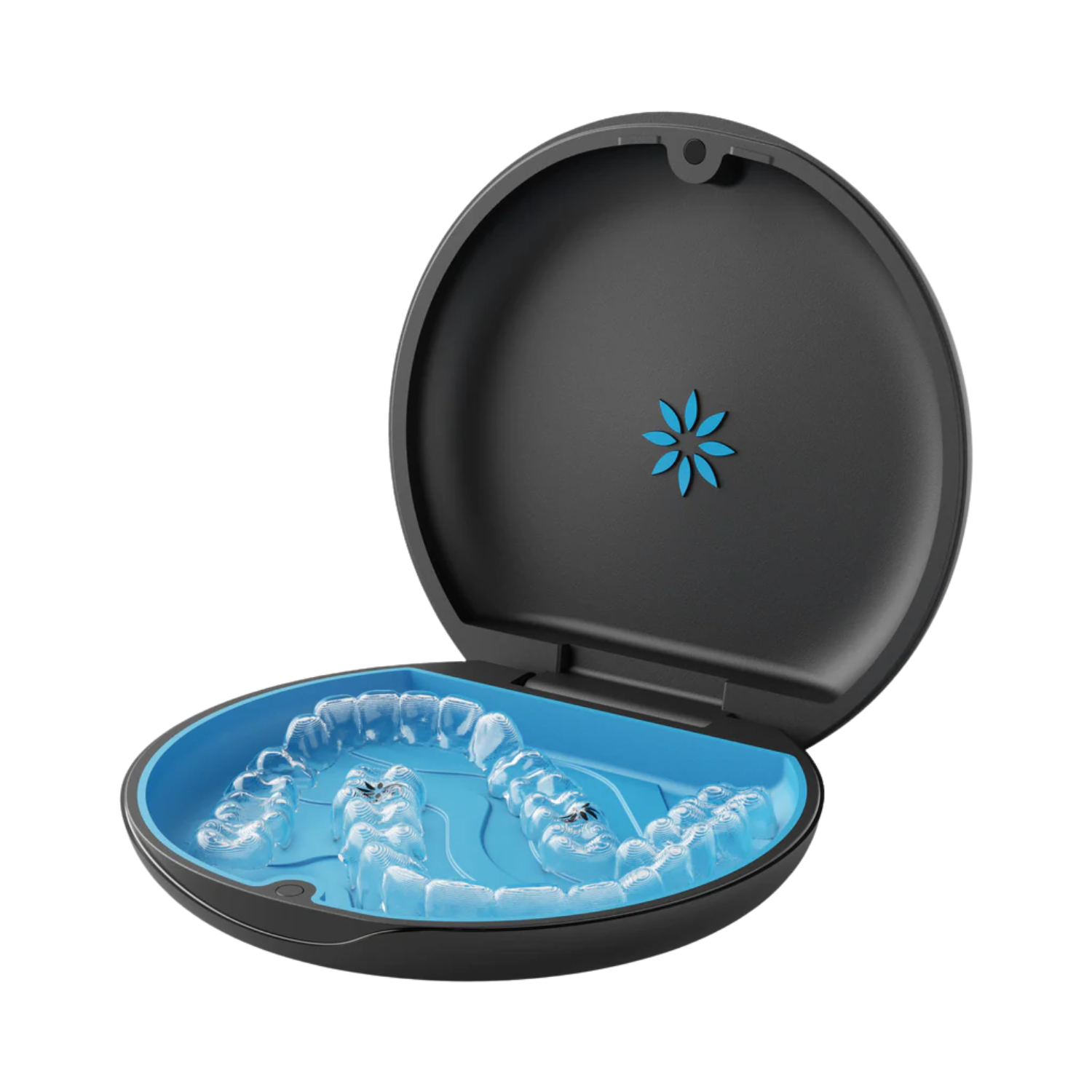 A clear dental aligner is displayed in a round, open black case with a blue interior. The case lid features a blue floral design, conveying a clean and modern look.