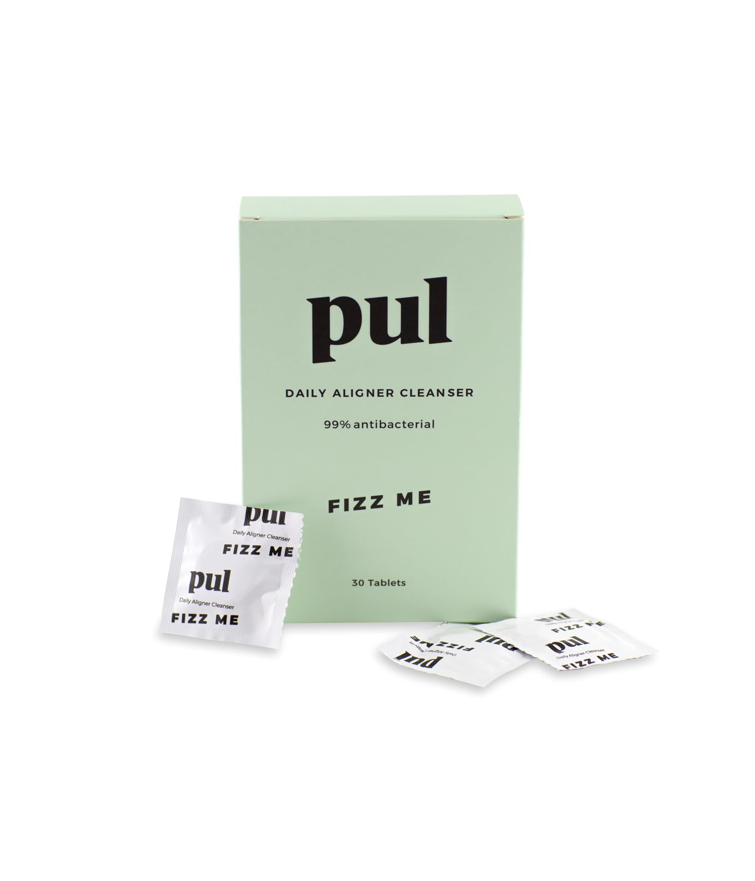 Green box labeled 'Pul Daily Aligner Cleanser, 99% antibacterial' with 'Fizz Me' and 30 tablet count. Three individual tablet packets nearby."