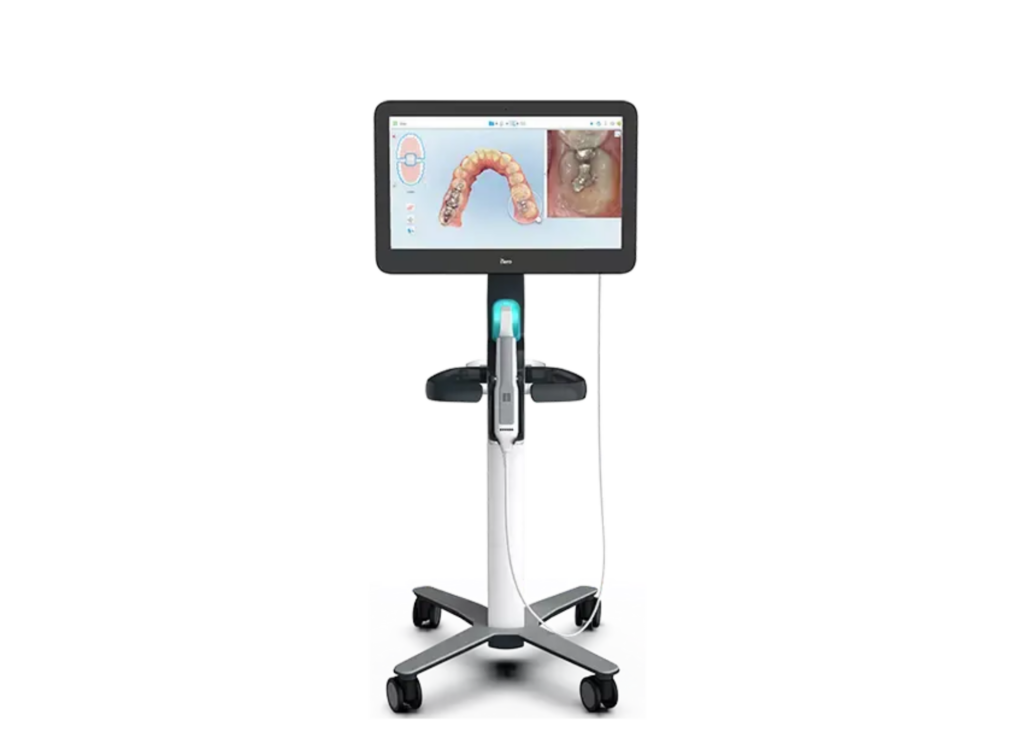 Mobile dental imaging device with a large screen displaying 3D teeth model and tooth scan, mounted on a wheeled stand. The setup looks modern and efficient.